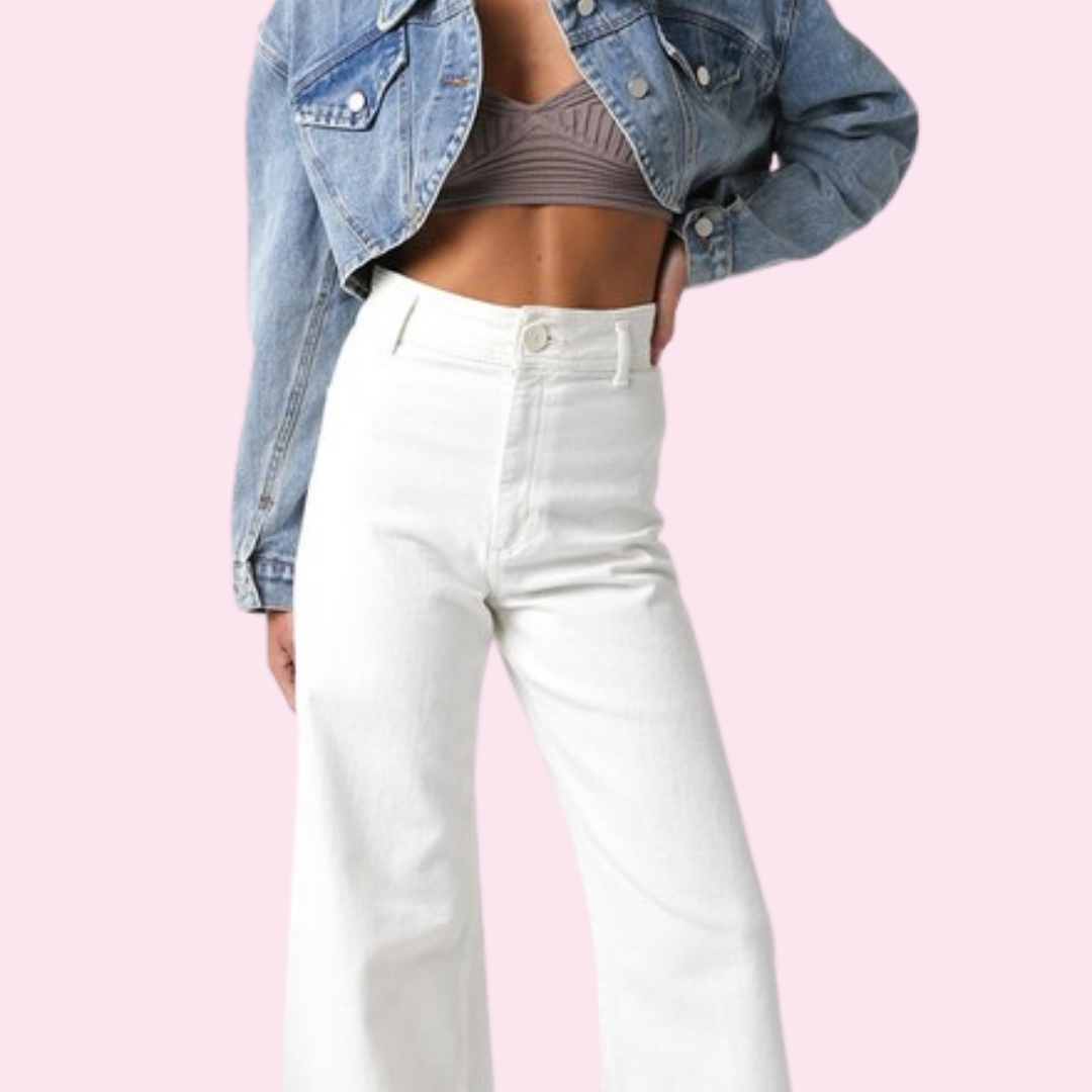 Justine Denim Crop Jacket featuring long sleeves and a high-low length, offering a stylish and versatile layering option for any outfit.