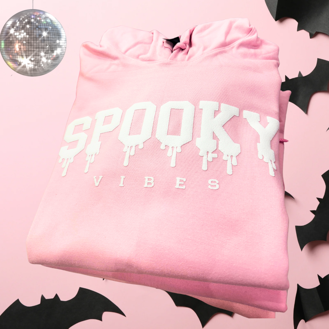 Spooky Vibes puff hoodie featuring a bold, festive design perfect for Halloween, offering a cozy and stylish fit for casual outings or seasonal fun.